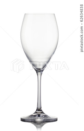 Empty glass of white wine on a white background. 62634838