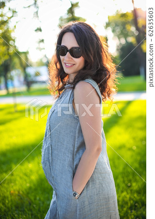 Pregnant woman outdoors 62635603