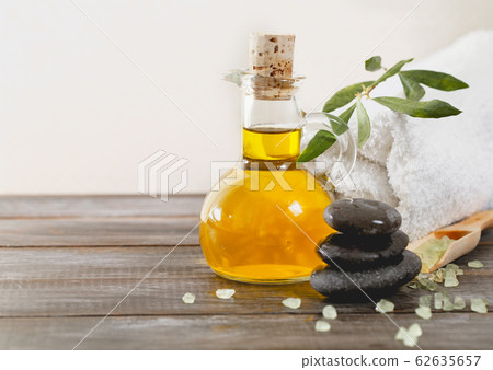 Spa supplies on wooden table 62635657