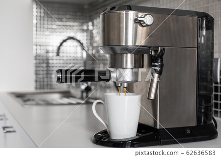 Close-up of making coffee in a coffee machine. 62636583