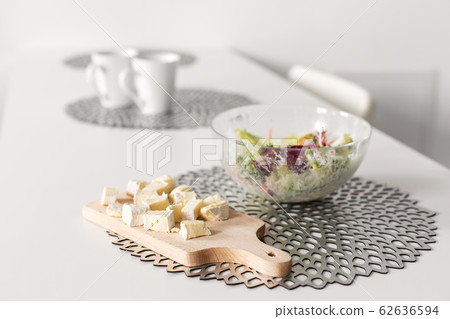 Healthy breakfast of fresh salad and cheese Healthy breakfast of fresh salad and cheese 62636594