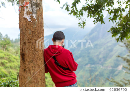 Tourist guy taking pictures of natural scenery on 62636790
