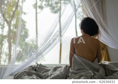 Tender young girl wakes up in the morning Tender young girl wakes up in the morning 62636832