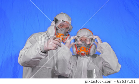 Doctor health worker in respirator. Slow motion. People portrait, wearing protect medical antibacterial antiviral aerosol spray paint mask. Doctor health worker in respirator. Slow motion. People portrait, wearing protect medical antibacterial antiviral aerosol spray paint mask. 62637191