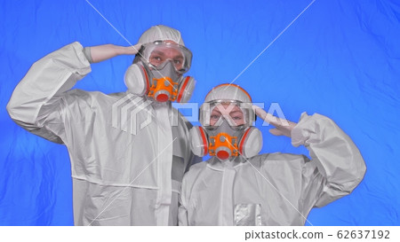Doctor health worker in respirator. Slow motion. People portrait, wearing protect medical antibacterial antiviral aerosol spray paint mask. Doctor health worker in respirator. Slow motion. People portrait, wearing protect medical antibacterial antiviral aerosol spray paint mask. 62637192