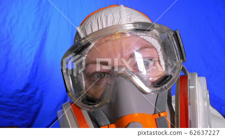 Scientist virologist in respirator. Woman close up look, wearing protective medical mask. Concept health safety N1H1 coronavirus epidemic 2019 nCoV. 62637227