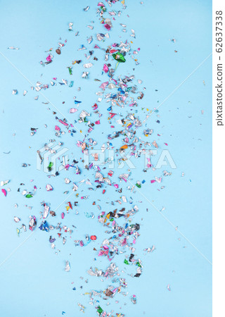 Multicolored confetti on blue background. 62637338
