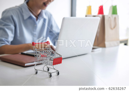 Woman using credit card register security code Woman using credit card register security code 62638267