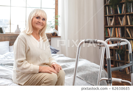 Senior woman with disability recovery at home walking frames 62638685
