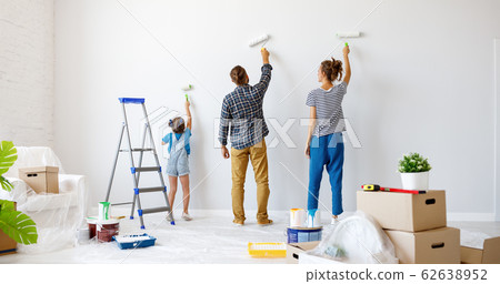 Repair in apartment. Happy family mother, father 62638952