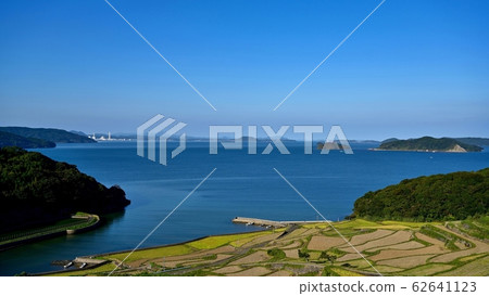 A view of the Tsuchiya rice terraces and the cobalt blue sea from the observatory @ Nagasaki 62641123