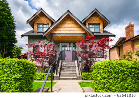 Luxury family house with stairwell over front yard on land terrace 62641816