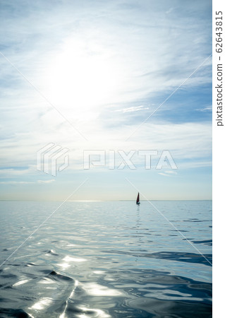 Beautiful summer landscape. Sea and sailboat on the horizon, against the blue sky, on a sunny day 62643815