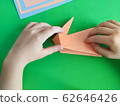 Origami step by step. How to make a paper bunny 62646426