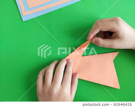 Origami step by step. How to make a paper bunny Origami step by step. How to make a paper bunny 62646428