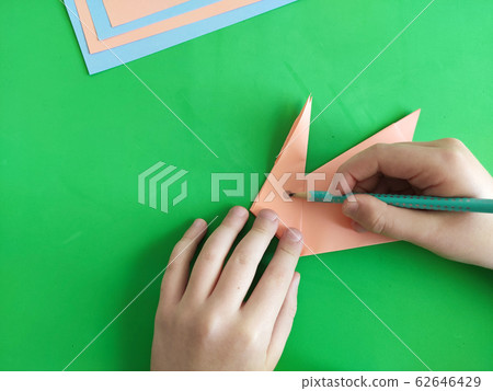 Origami step by step. How to make a paper bunny Origami step by step. How to make a paper bunny 62646429