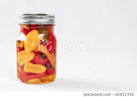 ar of pickled mix bell peppers and spices. 62652338