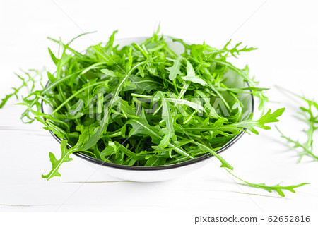 Fresh arugula or rocket leaves salad, rucola Fresh arugula or rocket leaves salad, rucola 62652816