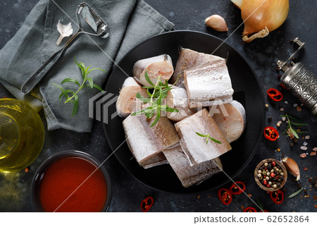 Raw fresh sliced hake fish with ingredients for Raw fresh sliced hake fish with ingredients for 62652864