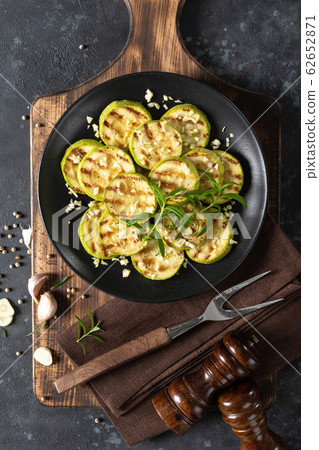 Grilled zucchini, courgette with garlic and Grilled zucchini, courgette with garlic and 62652871