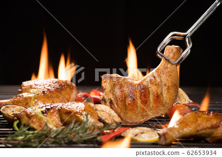 Grilled chicken thigh with various vegetables on  chopping wood 62653934