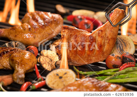 Grilled chicken thigh with various vegetables on chopping wood Grilled chicken thigh with various vegetables on chopping wood 62653936