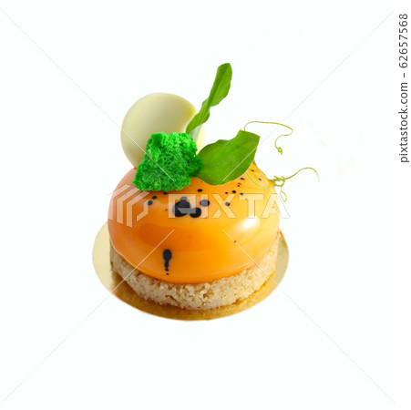Orange carrot cake with fresh pea leaves and white Orange carrot cake with fresh pea leaves and white 62657568