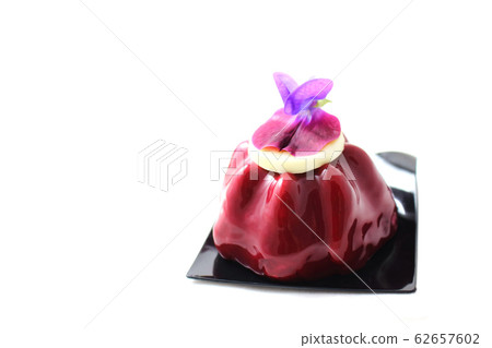 Red fruit dessert with purple pea flower Red fruit dessert with purple pea flower 62657602