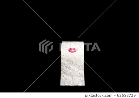 stained toilet paper roll with the red lips of a 62658729