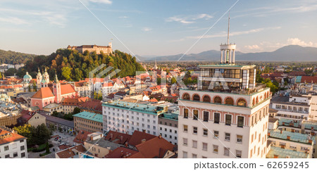 Cityscape of Ljubljana, capital of Slovenia, and it's old skyscraper in warm afternoon sun. Cityscape of Ljubljana, capital of Slovenia, and it's old skyscraper in warm afternoon sun. 62659245