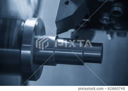 The CNC lathe machine in metal working process. The CNC lathe machine in metal working process. 62660748