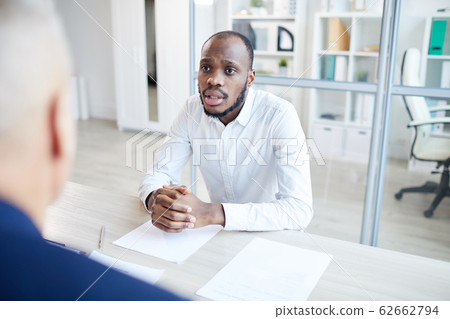 African-America Businessman Talking to partner Across Table 62662794