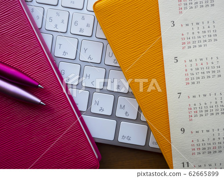 Business image · calendar · keyboard · notebook · woman 62665899