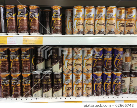 Coffee drinks in many flavours in aluminium cans. It comes in many brands. Some are mixed with cream as a seasoning. On display for sale on supermarket shelves. 62666748