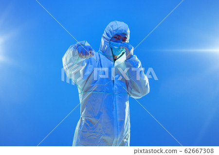 Medic in white hazmat protective suit, coronavirus illustration concept Medic in white hazmat protective suit, coronavirus illustration concept 62667308