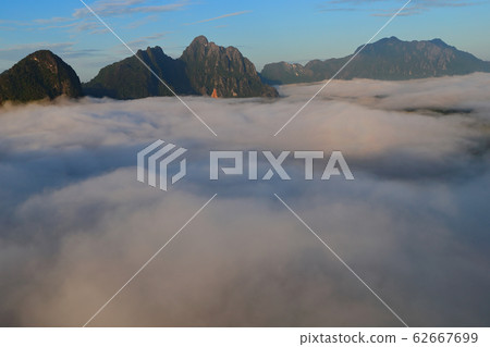 Landscape with sea of clouds in Vang Vieng, Laos Landscape with sea of clouds in Vang Vieng, Laos 62667699