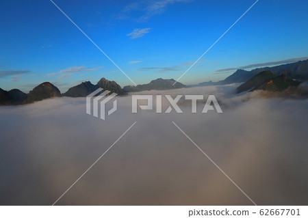 Landscape with sea of clouds in Vang Vieng, Laos Landscape with sea of clouds in Vang Vieng, Laos 62667701