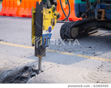 Road works  building site excavator and worker 62668489