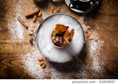 Chocolate mousse served with liquid ice smoke 62668697