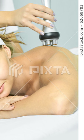 Perfect radio treatment. Woman at spa procedure. 62669783