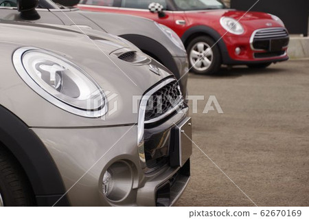 Cars lined up at dealers Import cars Minis 62670169