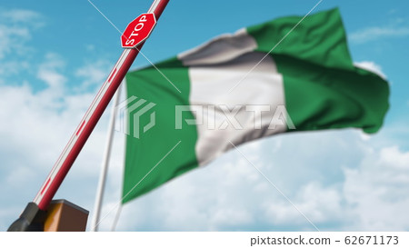 Opening boom barrier with stop sign against the Nigerian flag. Free border crossing or lifting a ban in Nigeria. 3D rendering 62671173