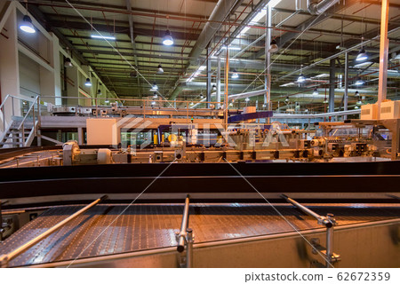 Industrial interior of soft drinks factory with tubes Industrial interior of soft drinks factory with tubes 62672359