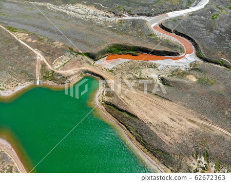 Small red water river and green water lake in Bogdo-Baskunchak Nature Reserve 62672363