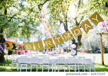 A table set for kids birthday party outdoors in garden in summer. 62673147