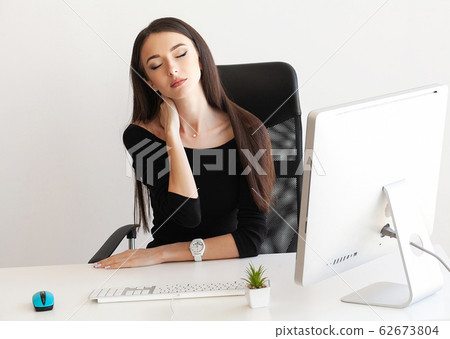 Pain neck. Tired business woman holding her neck Pain neck. Tired business woman holding her neck 62673804