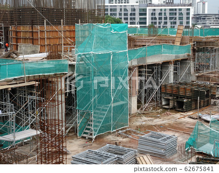 Temporary access and metal staircase made from staging and scaffolding the construction site. Designed by licence scaffolder to make sure it is safe to use. 62675841