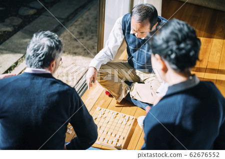 Senior man playing shogi Senior man playing shogi 62676552