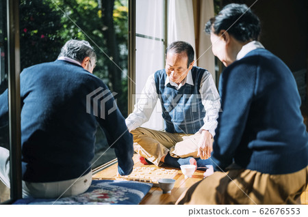 Senior man playing shogi Senior man playing shogi 62676553