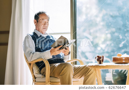 Senior men reading a book Senior men reading a book 62676647